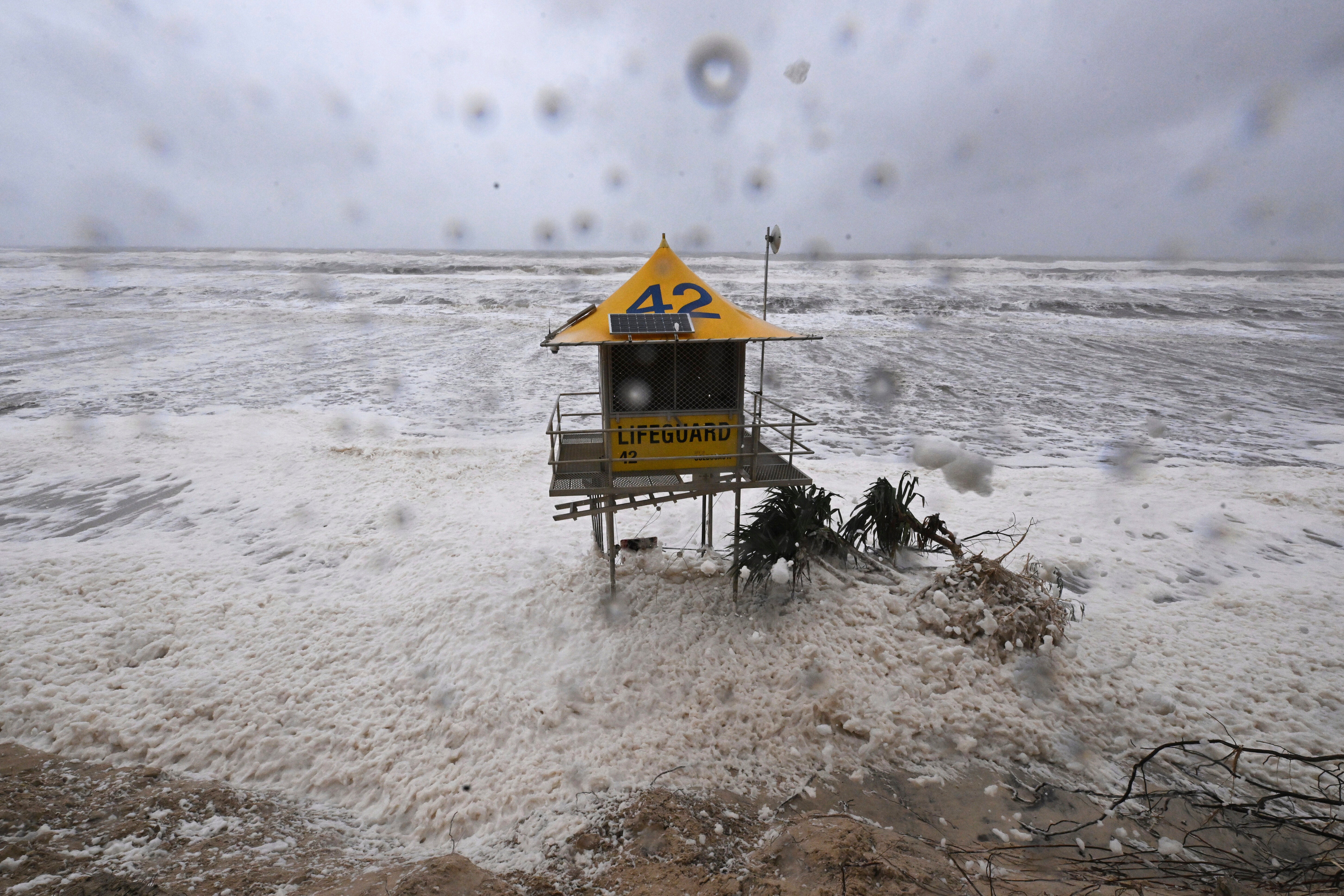 A lifeguard tower is surrounded by heavy seas following Cyclone Alfred on the Gold Coast, Australia, Saturday, 8 March 2025