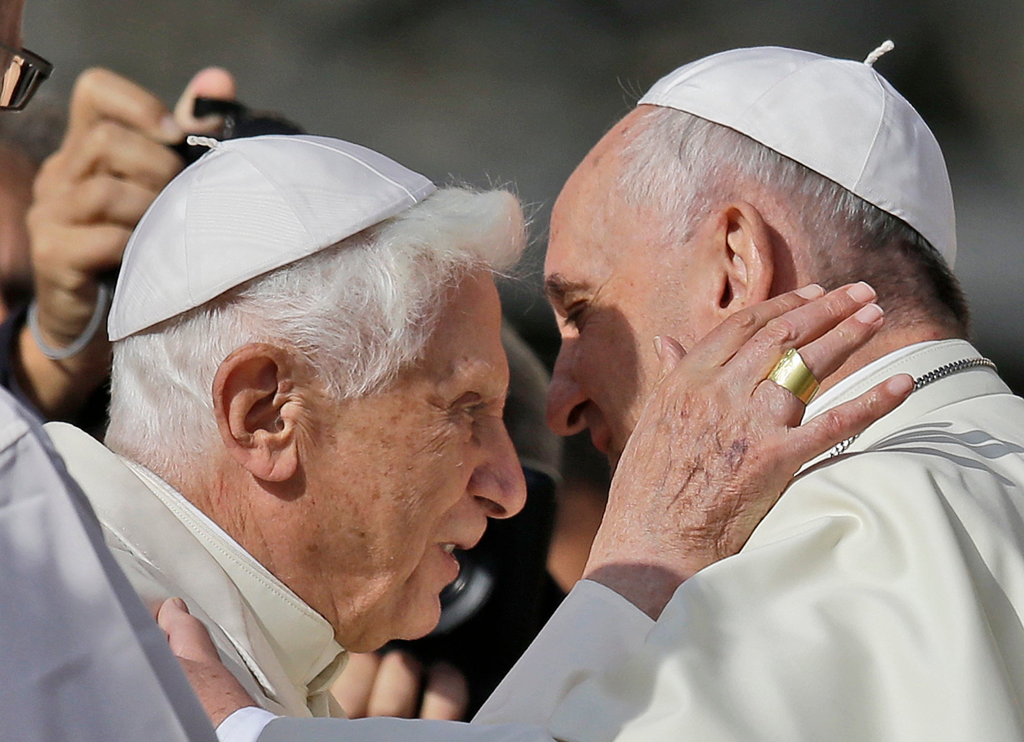 Pope Francis, right, hugs Pope Emeritus Benedict XVI in 2014