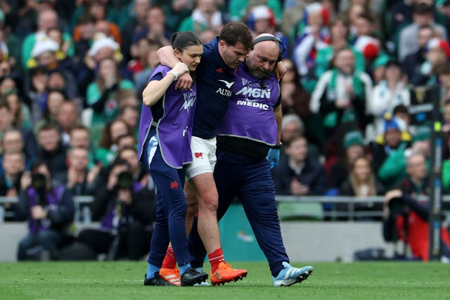 <p>Antoine Dupont had to be helped off in Dublin</p>