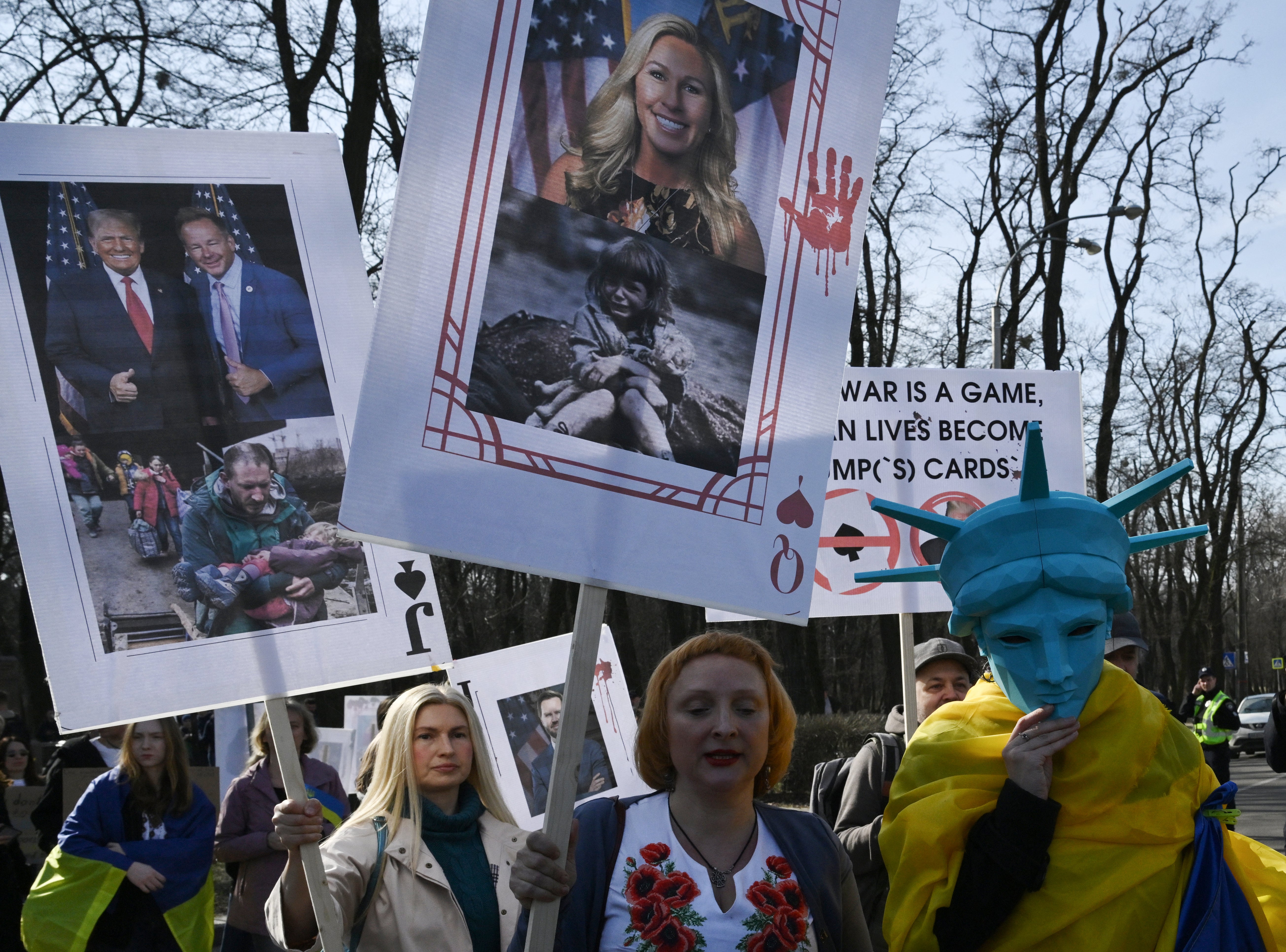 A demonstrator (c) depicts a placard as Marjouri Taylor Green, the American Congress in protest in the name of 