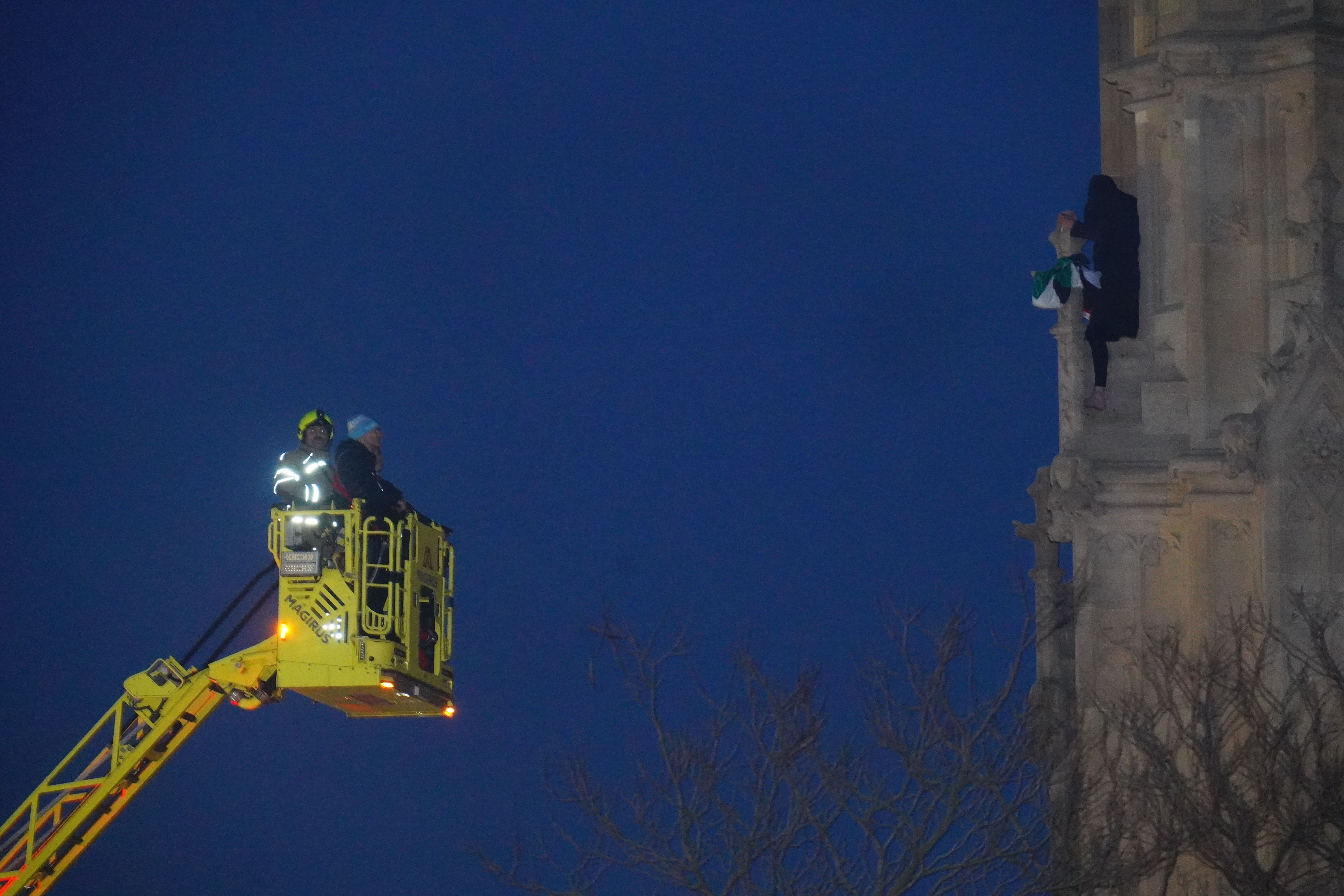 A protester on the Elizabeth Tower (James Manning/PA)