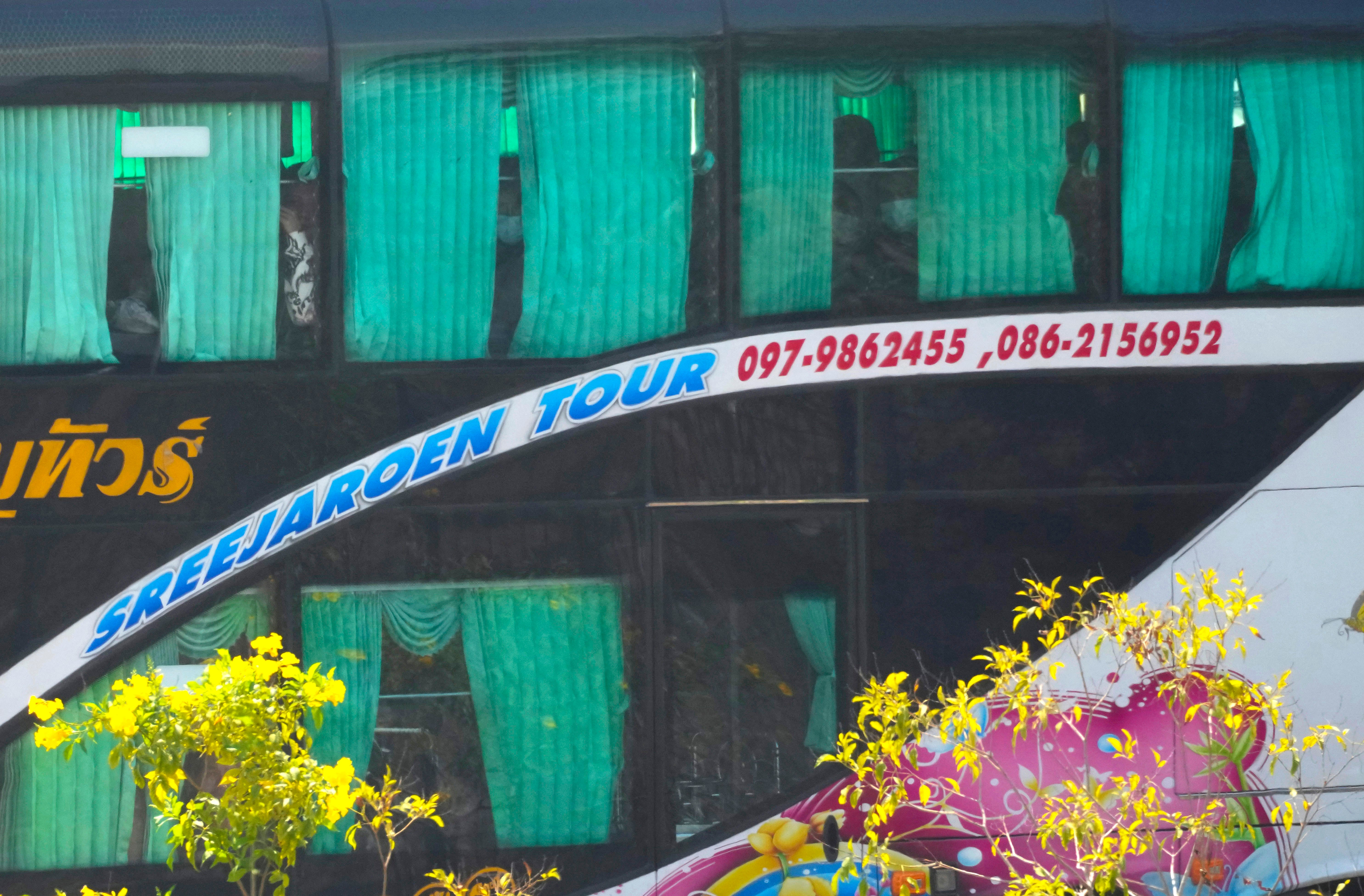 A bus carrying some of the thousands who were freed