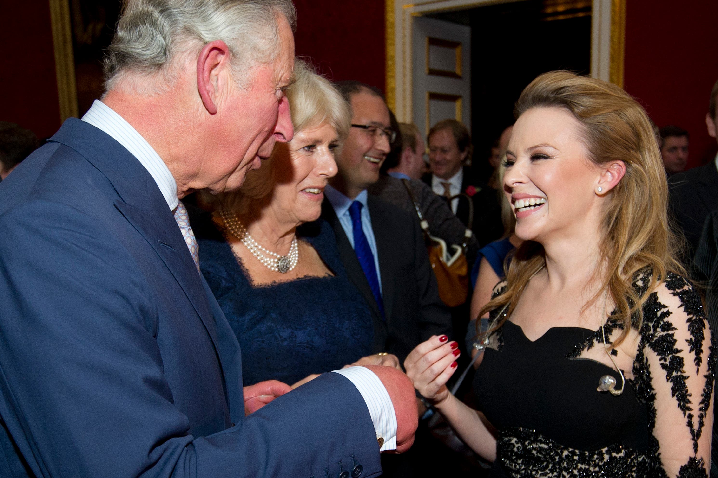 The King with Australian pop singer Kylie Minogue (Carl Court/PA)