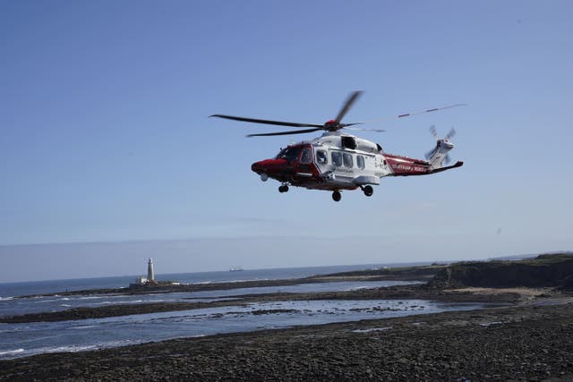 An HM coastguard helicopter (Owen Humphreys/PA)