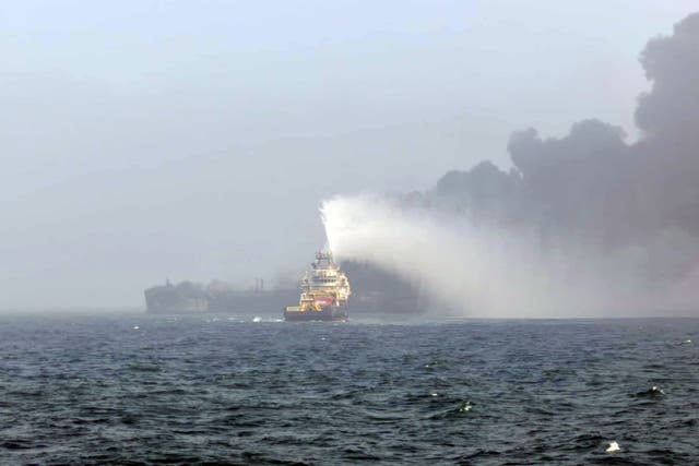 <p>Smoke billowing into the air after a crash between an oil tanker and a cargo ship off the coast of East Yorkshire (Bartek Smialek)</p>