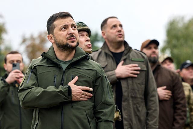 <p>Volodymyr Zelensky attends a ceremony of the Ukrainian flag rising in the reclaimed city of Izyum in Kharkiv, 14 September 2022</p>