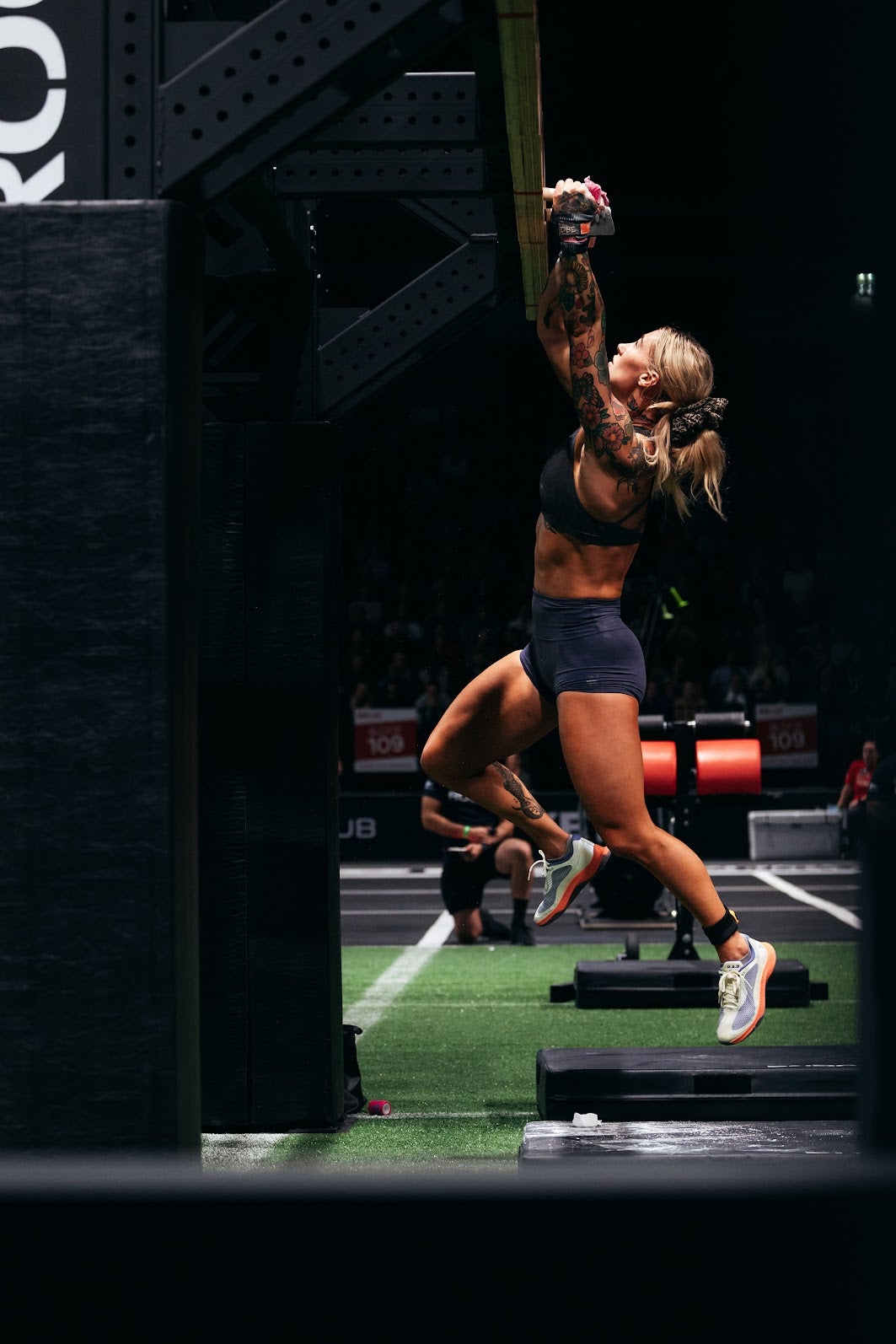 Danielle Brandon making her way across a horizontal pegboard