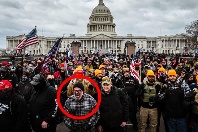 <p>Pro-Trump protesters, including Proud Boys leader Joe Biggs, (plaid shirt at bottom center of frame,) gather in front of the U.S. Capitol Building on January 6, 2021 in Washington, D.C. </p>