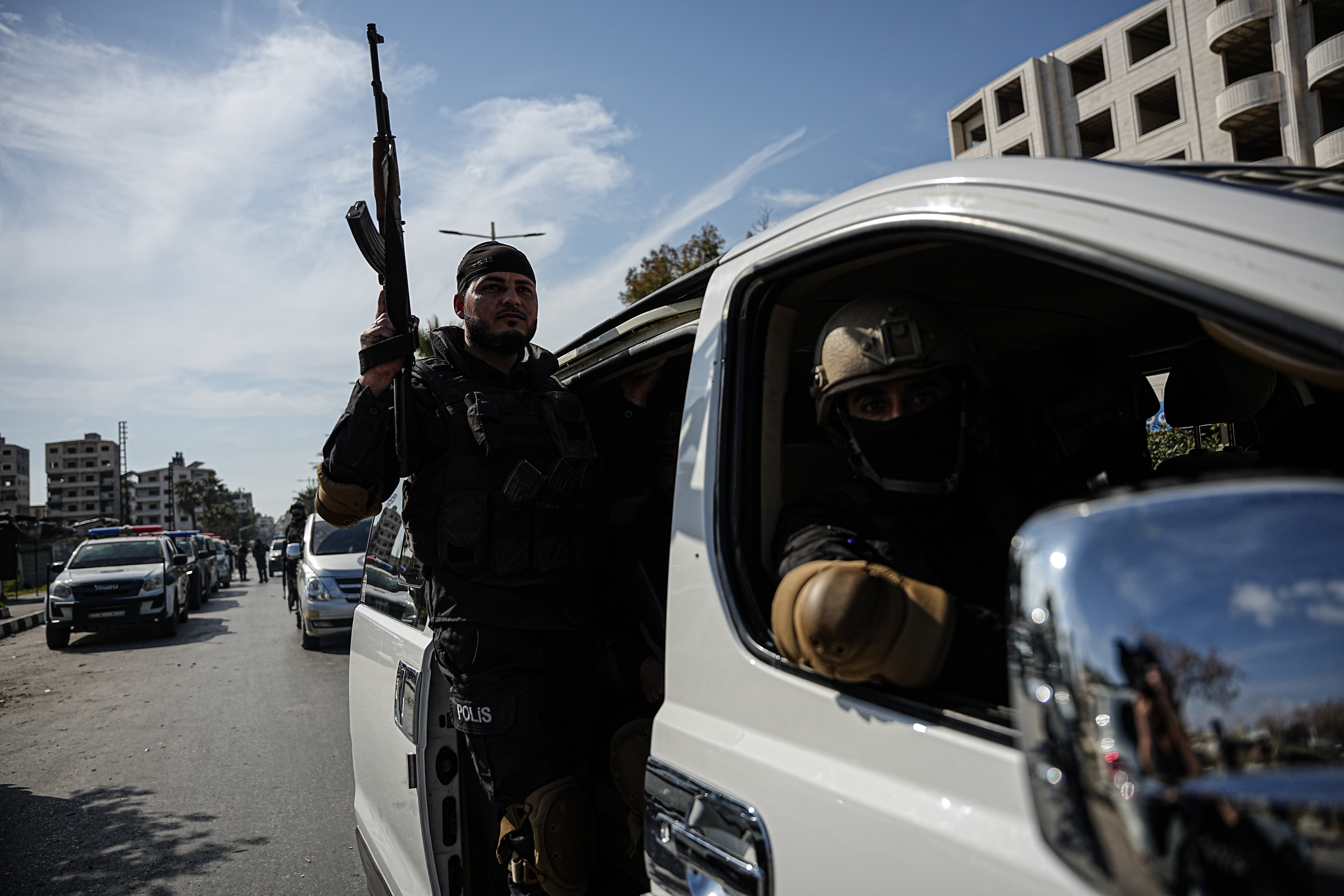 Syrian forces patrol a street following violence in Jableh town of Latakia