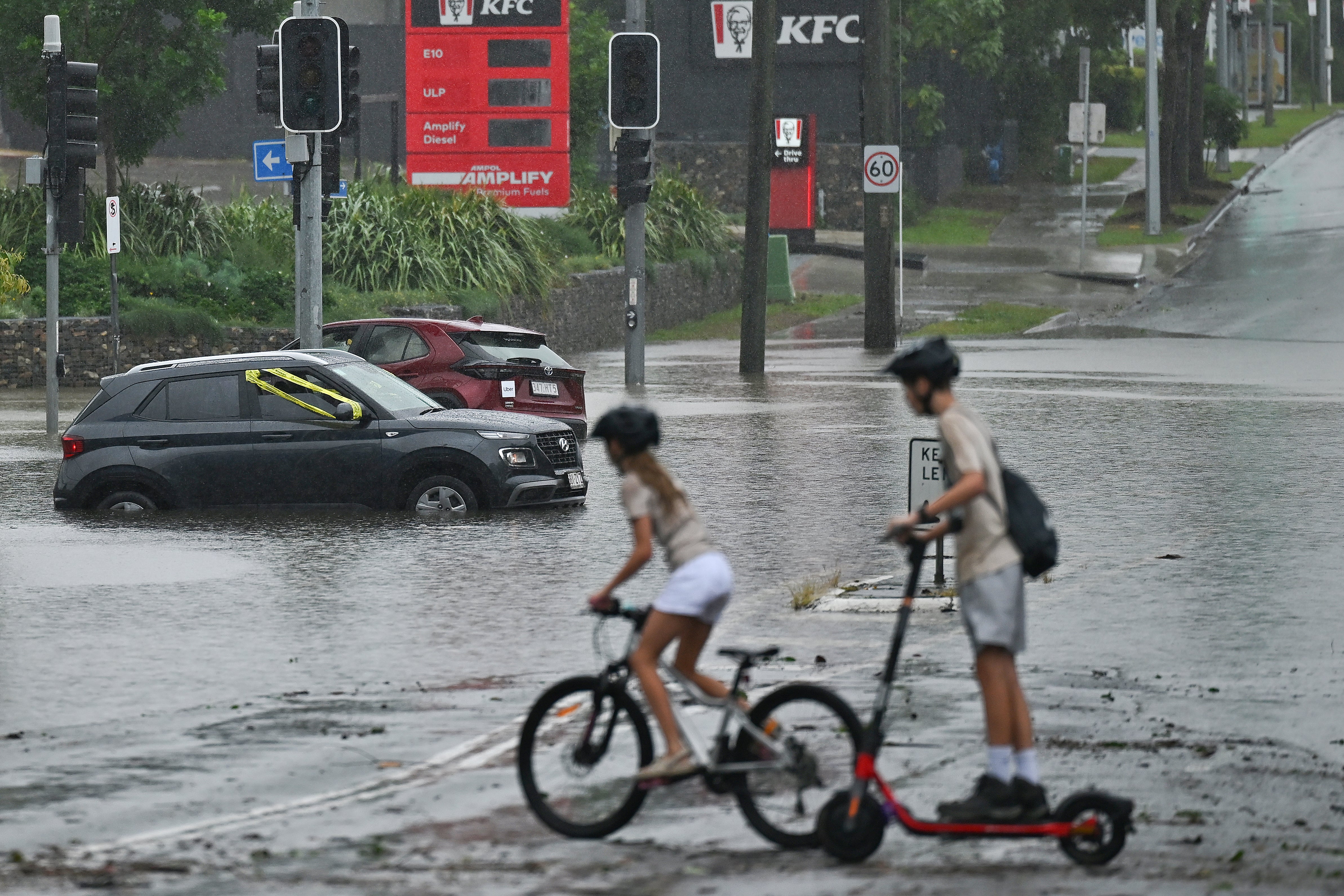 Flooded cars are seen on Newmarket Road in the suburb of Wilston in Brisbane on 10 March 2025