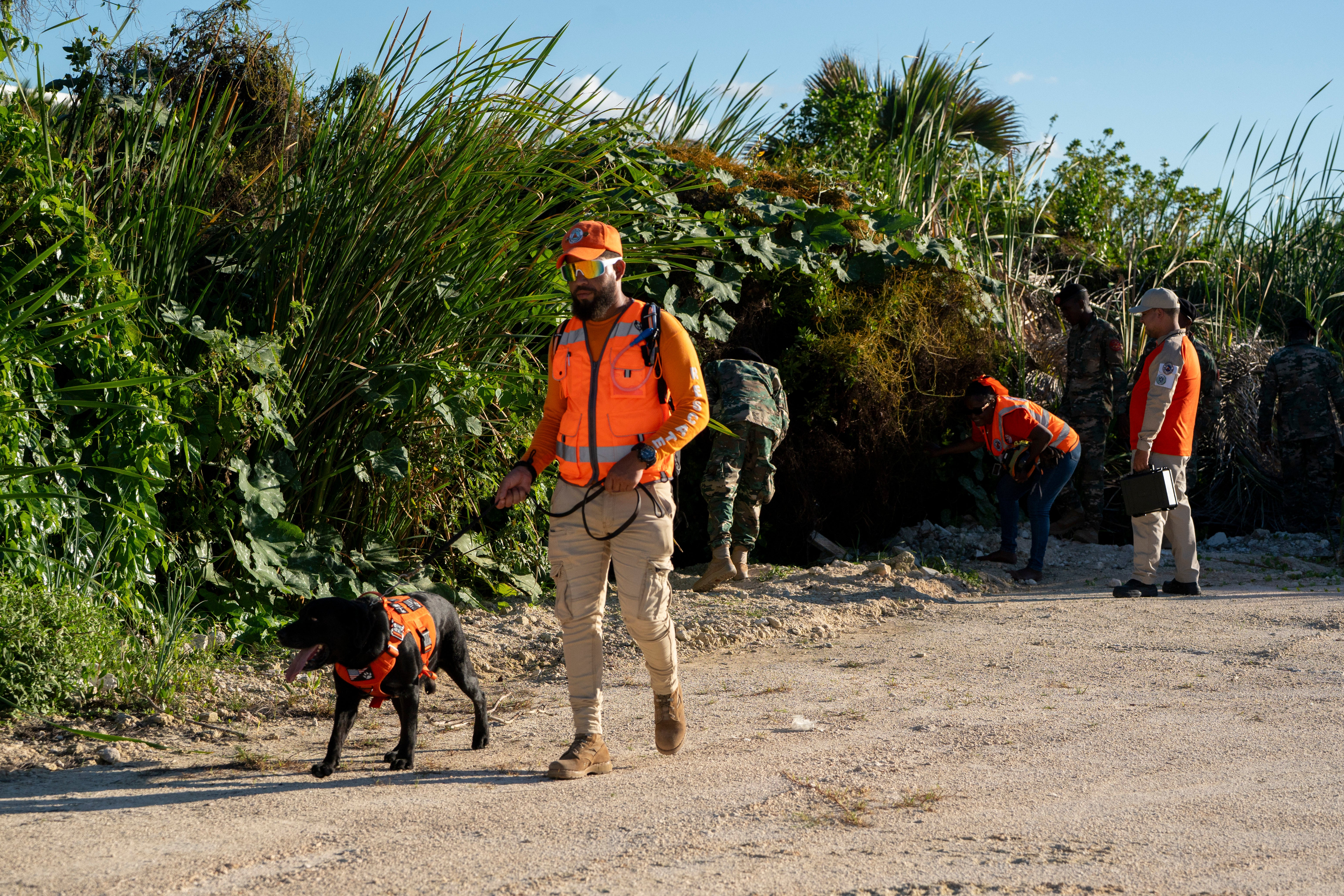 Dominican officials search the beach where Konanki disappeared last week