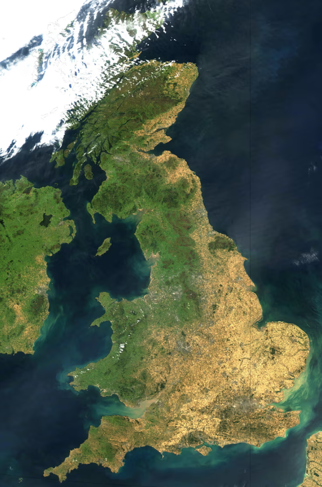 <p>Temperatures soared to 40C for the first time in August 2022. A satellite image shows vast parts of the UK completely dried out</p>
