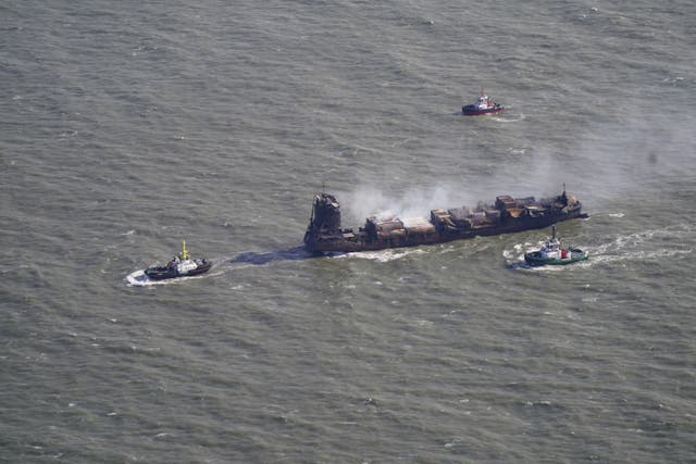 Tug boats shadow the Solong container ship as it drifts in the Humber Estuary, off the coast of East Yorkshire following a collision with the MV Stena Immaculate oil tanker, operating as part of the US government’s Tanker Security Programme, on Monday. Picture date: Tuesday March 11, 2025.