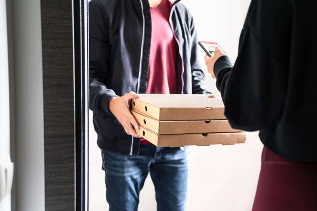 Food delivery companies should disclose the identities of riders and drivers amid fears of visa abuse (Alamy/PA)