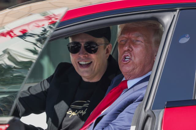 <p>Donald Trump and Elon Musk speak to reporters as they sit in a red Model S Tesla vehicle on the south lawn of the White House (Pool via AP/PA)</p>