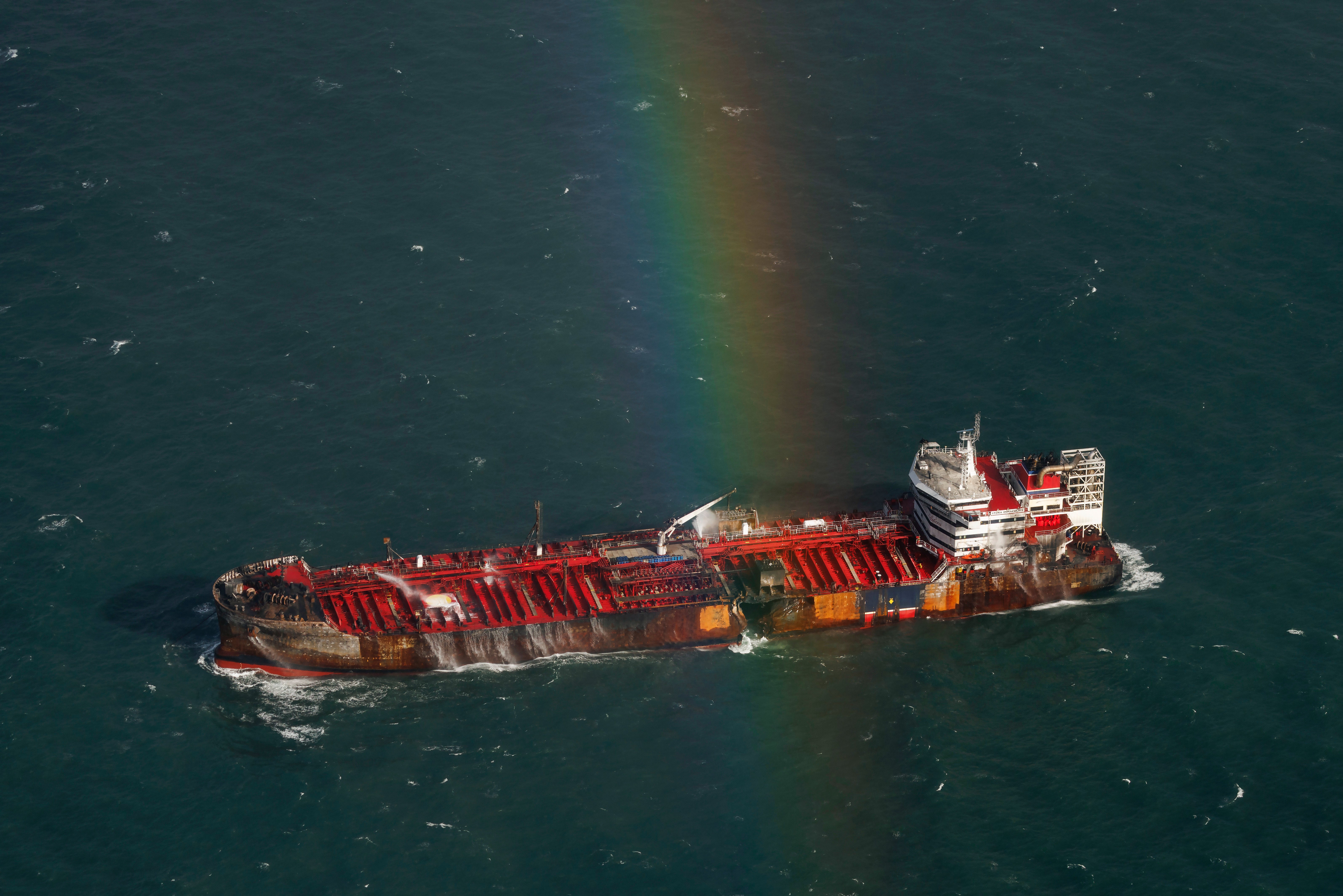 The ‘Stena Immaculate’ remains at anchor surrounded by safety tugboats