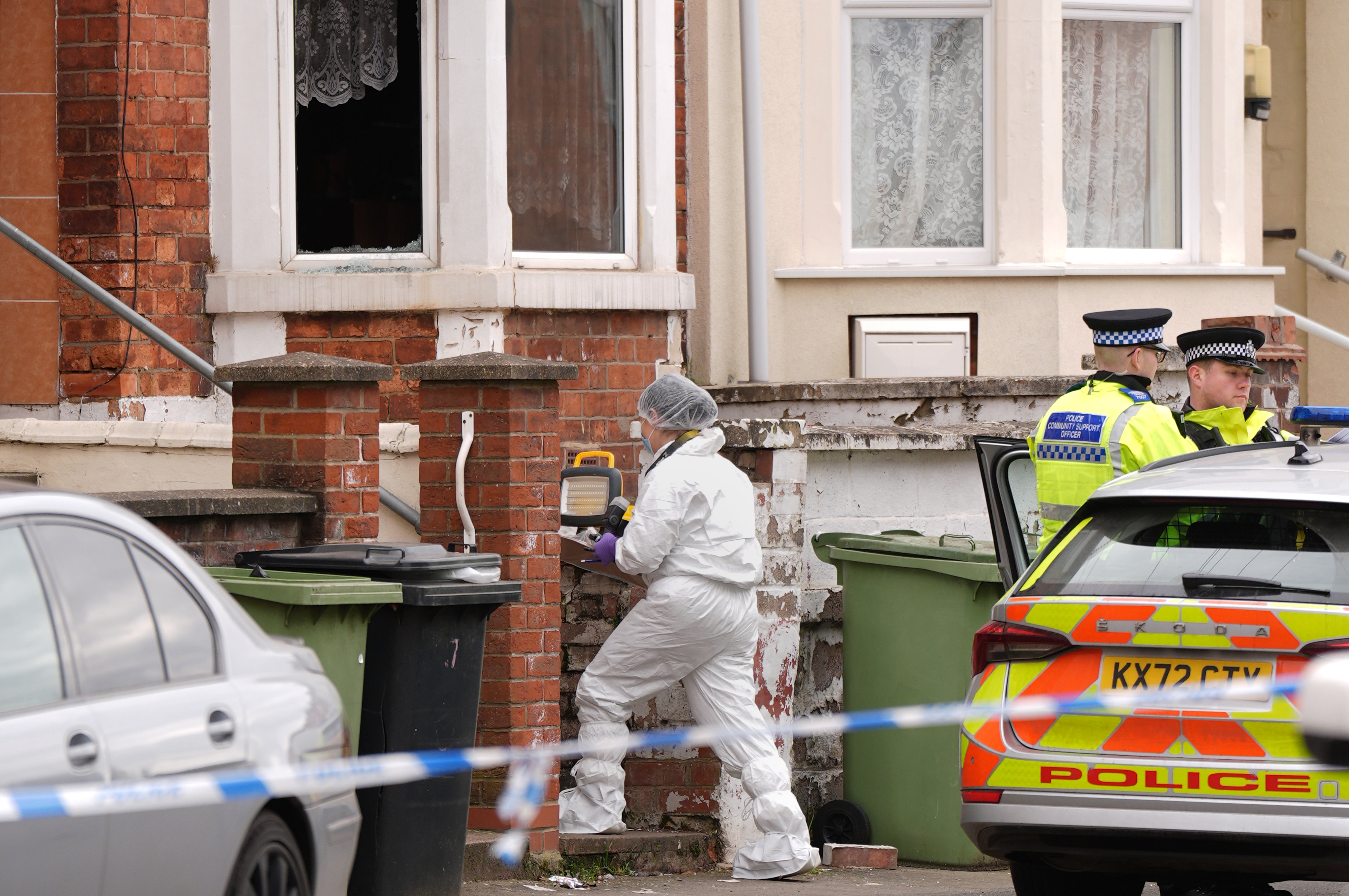 Forensic officers remain at the scene on Newcomen Road