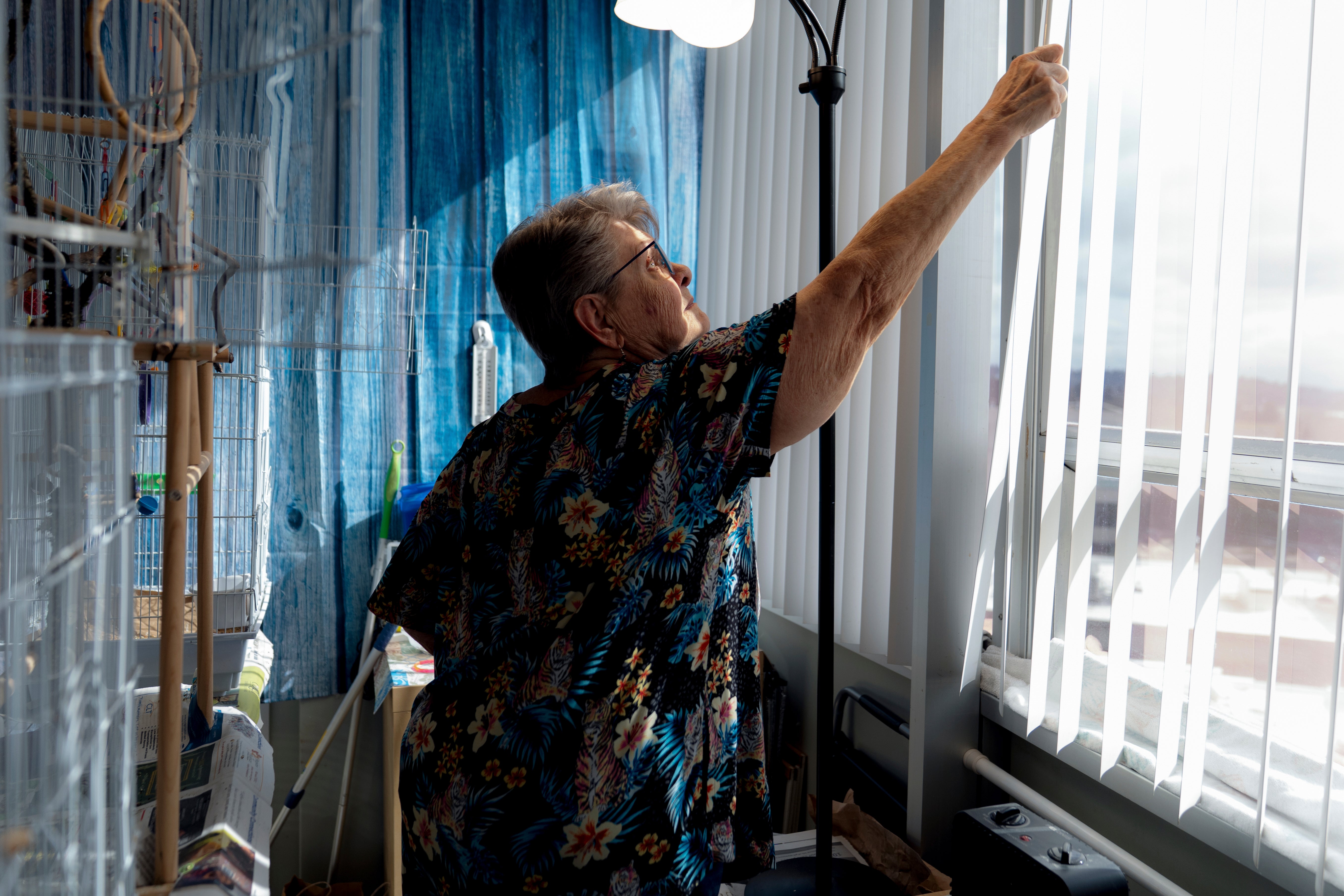 Resident Phyllis Goss inside her studio apartment at Smith Tower Apartments in Vancouver, Washington. The building, which could be one of those affected by the latest cuts, needs updates including a sprinkler system