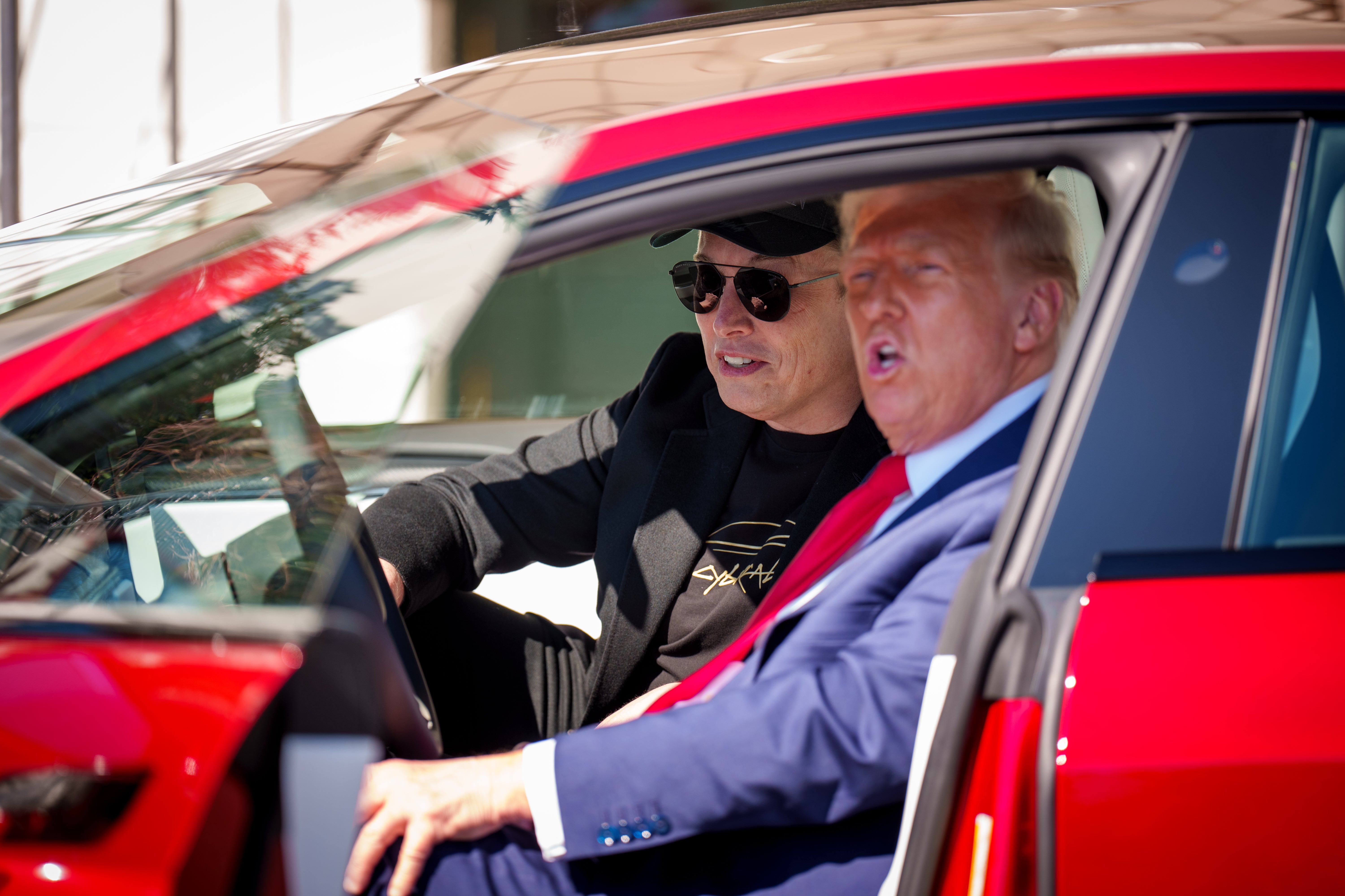 US President Donald Trump and adviser Elon Musk in a Tesla