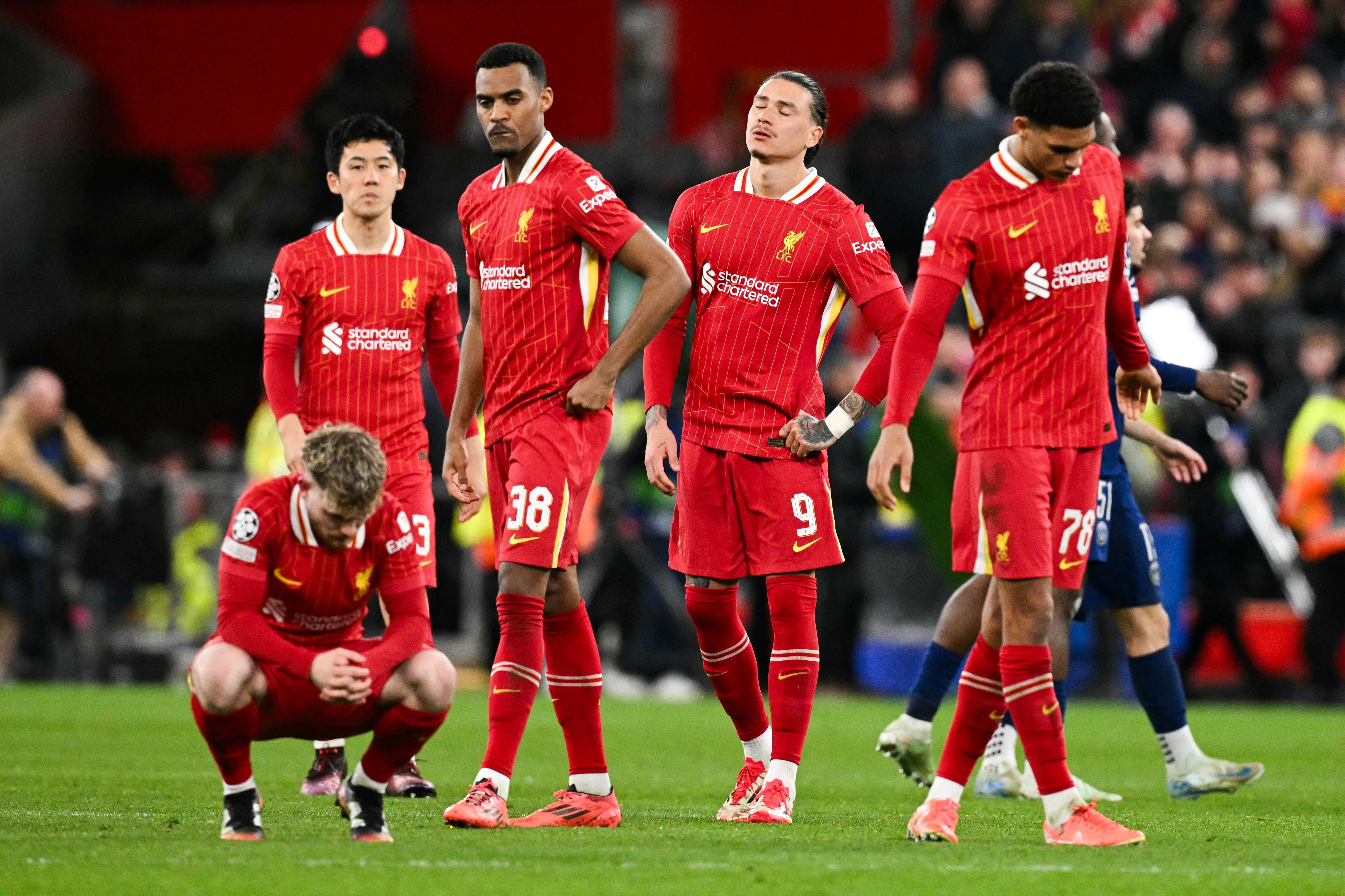 Liverpool players react after defeat by Paris Saint-Germain at Anfield