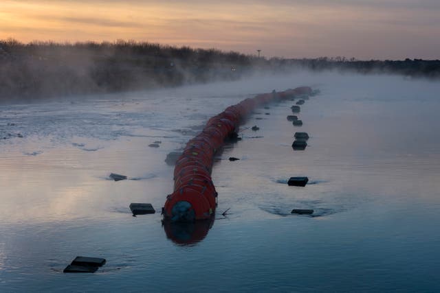 <p>In an aerial view, a floating barrier ordered by Texas Governor Greg Abbott lies atop the Rio Grande on January 10, 2024 in Eagle Pass, Texas</p>