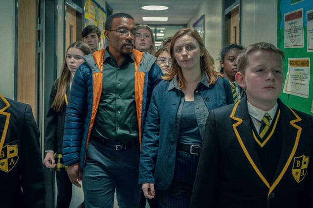 <p>Ashley Walters, centre left, as DI Luke Bascombe in Adolescence</p>