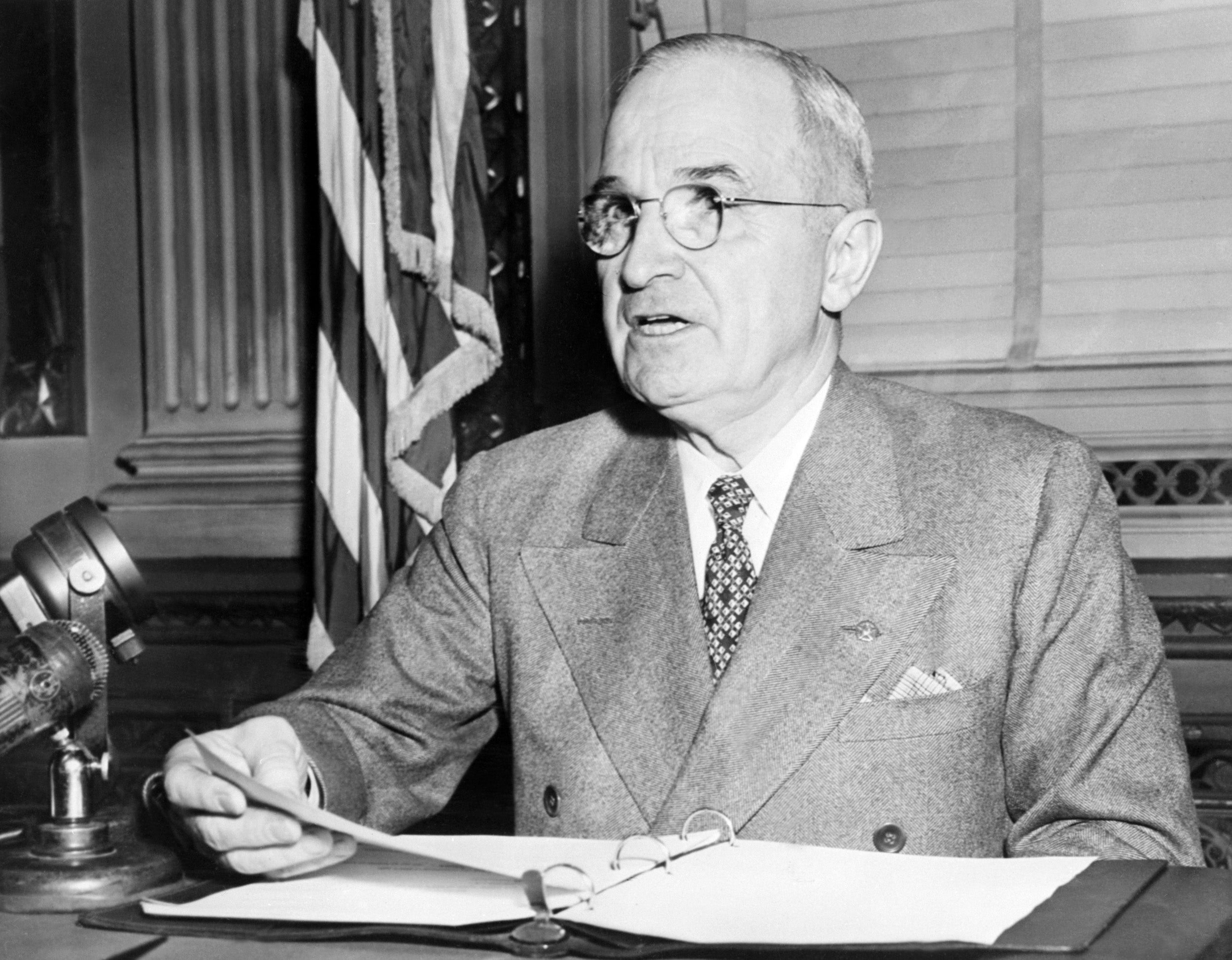 Harry Truman (1884-1972), the 33rd President of the USA, addresses media in 1945 in Washington, D.C. His administration used the Alien Enemies Act until 1951