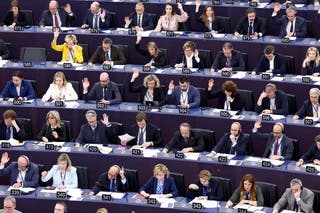 Members of the European Parliament take part in a voting session during a plenary session at the European Parliament