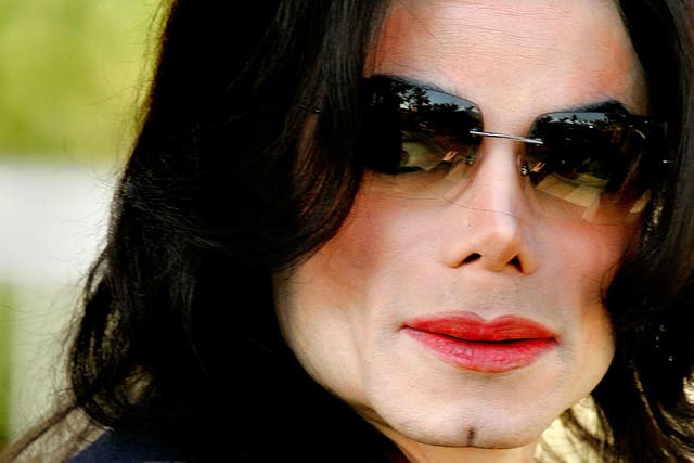 <p>Michael Jackson pictured outside court in 2005</p>