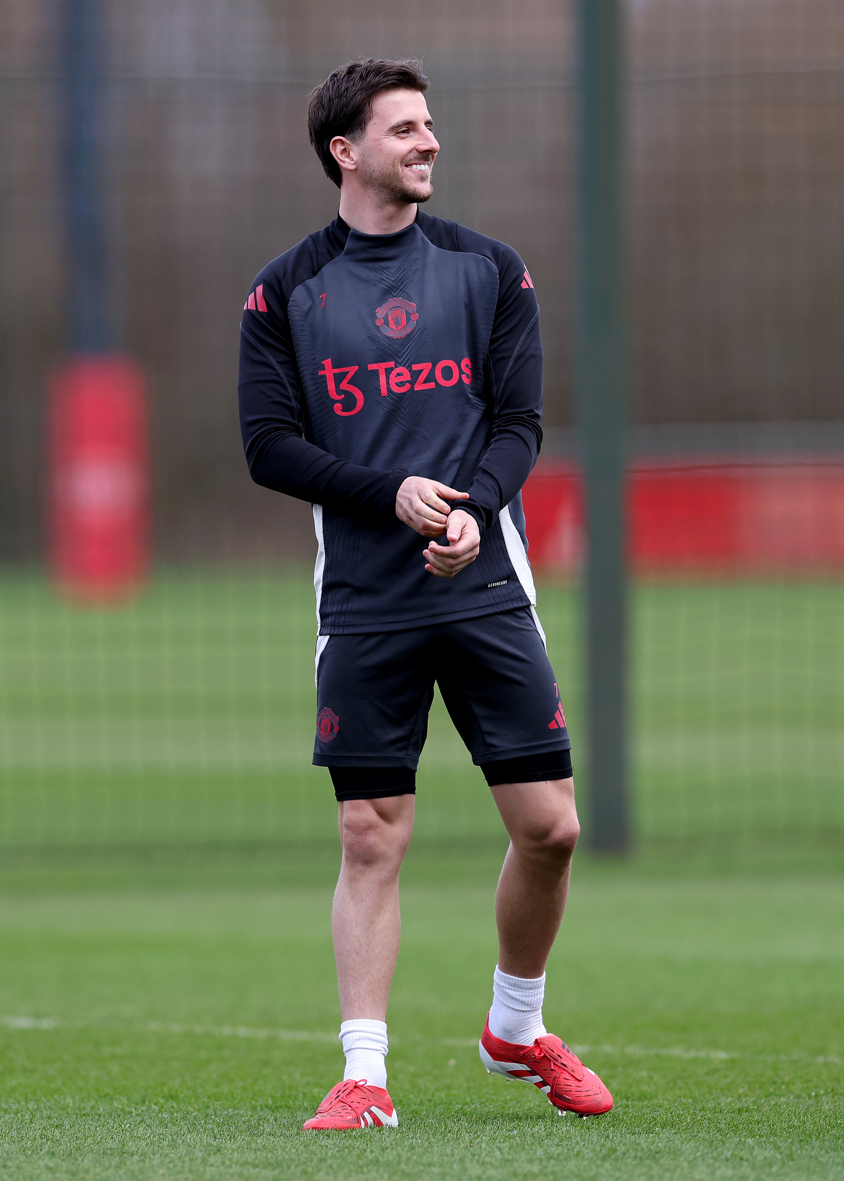 Mason Mount of Manchester United looks on during training