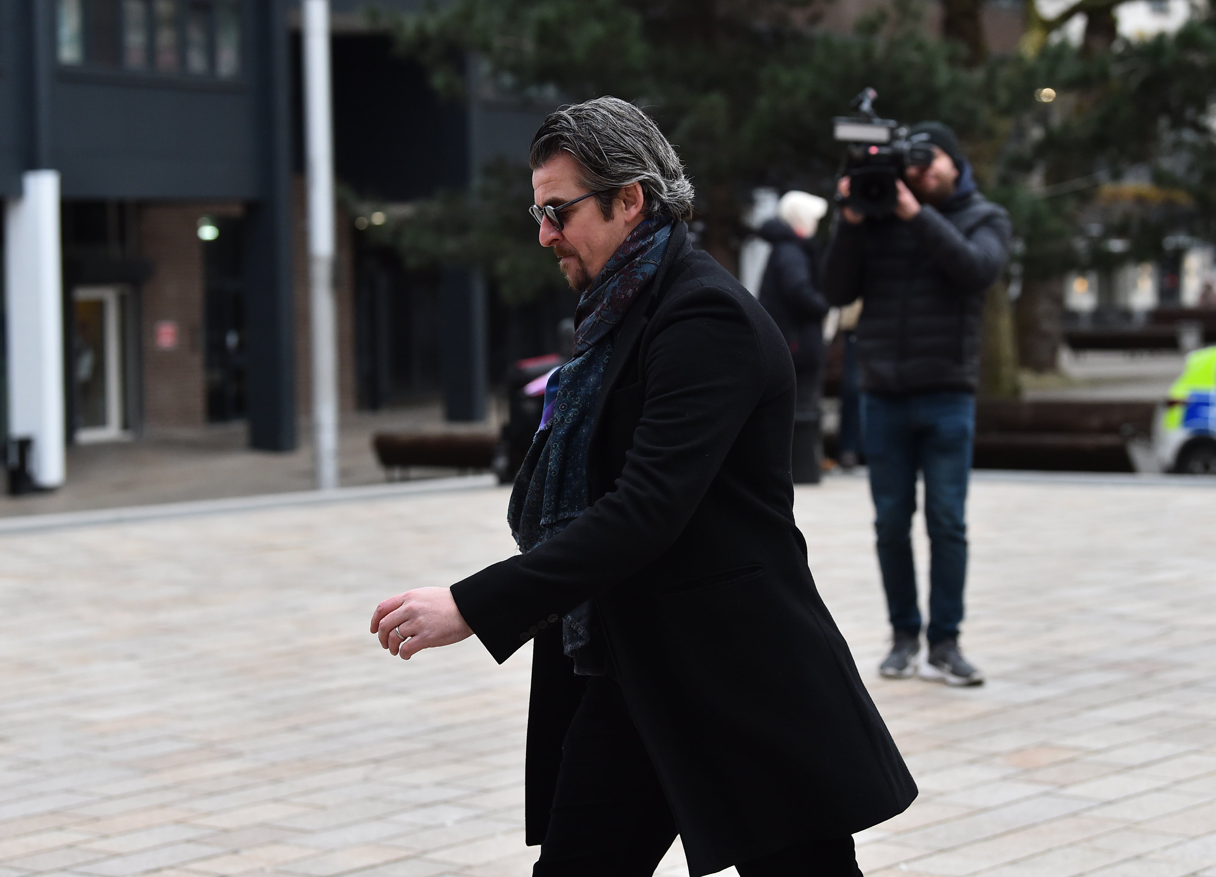 Joey Barton arrives at Liverpool Crown Court, where he is charged with sending offensive messages to commentator Lucy Ward and TV presenter Jeremy Vine