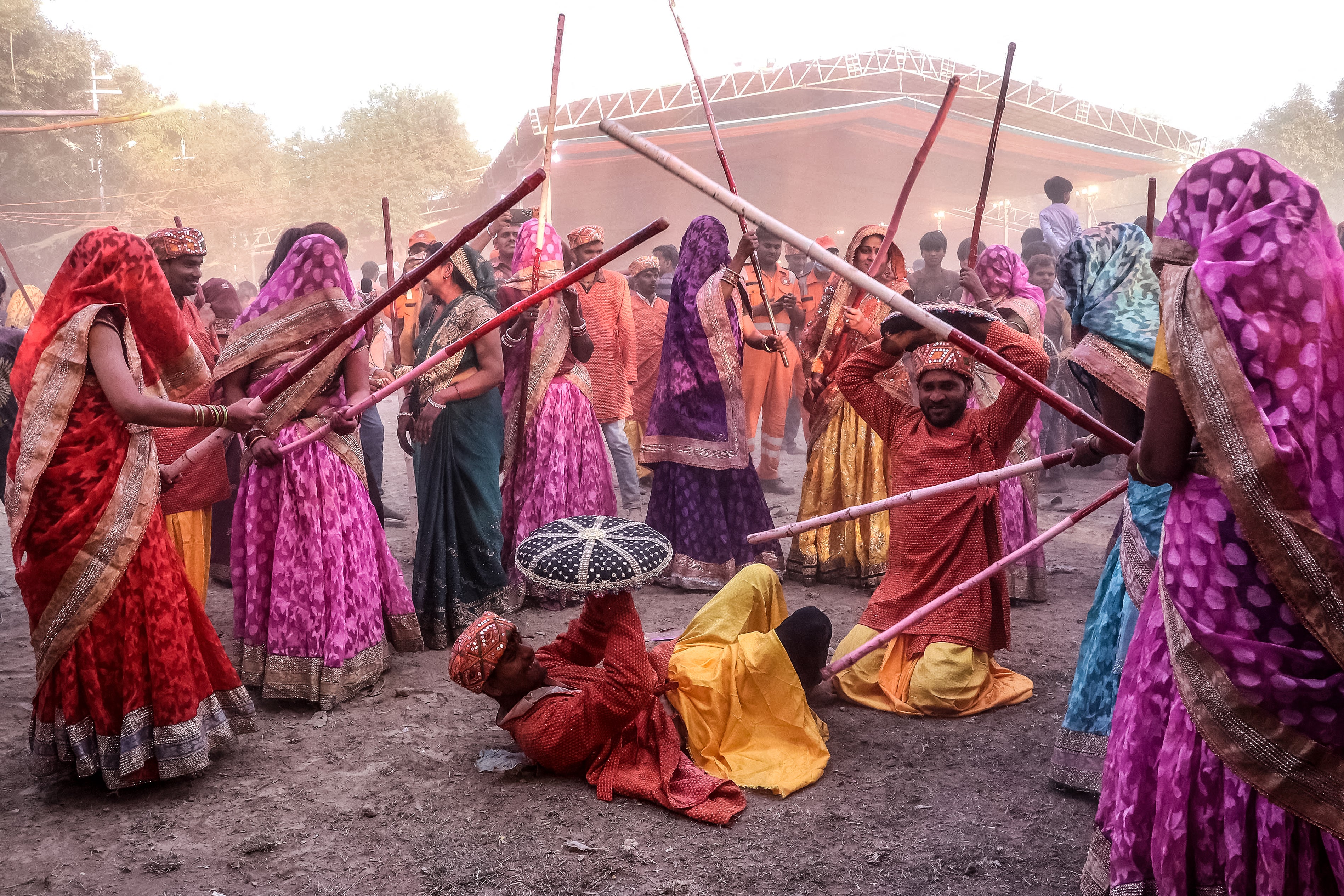 Women playfully hit revellers with sticks as a traditional ritual during the Lathmar Holi celebrations in Mathura in the northern state of Uttar Pradesh