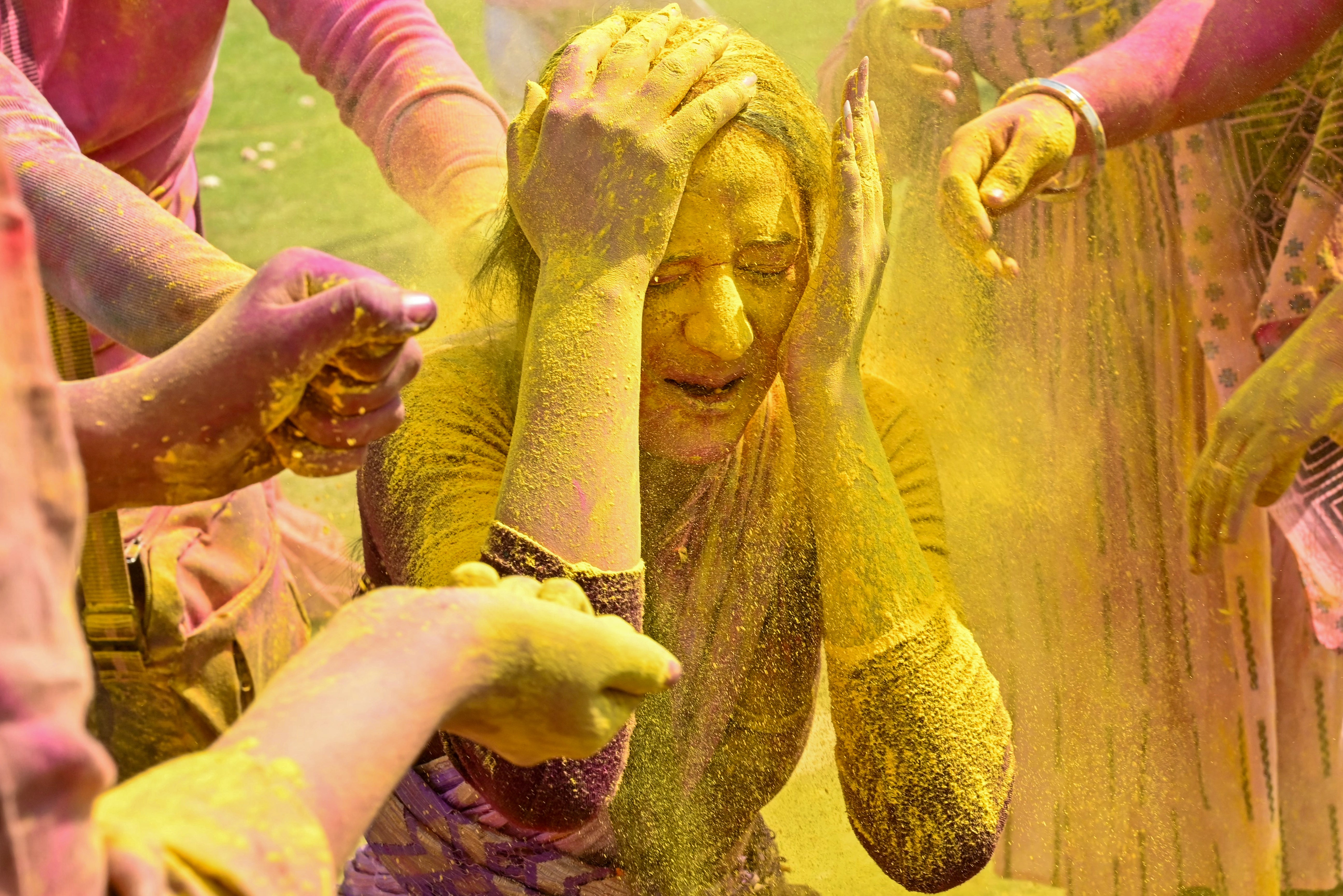 A devotee of International Society for Krishna Consciousness celebrates Holi at a temple on the outskirts of the northern city of Amritsar