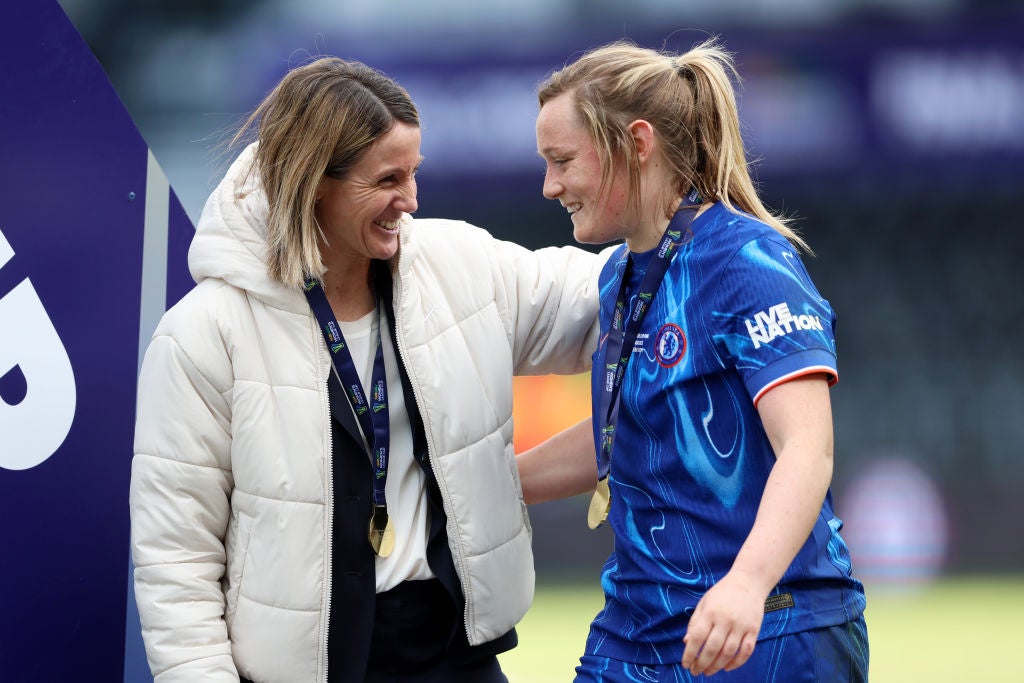 Bompastor stayed on the edge of Chelsea’s celebrations as she lifted her first trophy in England