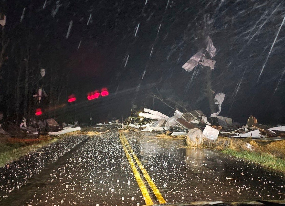 Debris covers the road during a severe storm slams the area north of Seymour, Missouri late Friday, March 14, 2025. (Trooper Austin James/Missouri State Highway Patrol via AP)