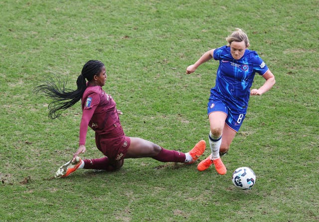 <p>Erin Cuthbert is challenged by Khadija Shaw during the League Cup final at Pride Park</p>