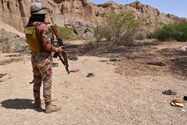 <p>File. A Frontier Corps soldier stands guard at the site after militants ambushed a train in Balochistan, Pakistan</p>