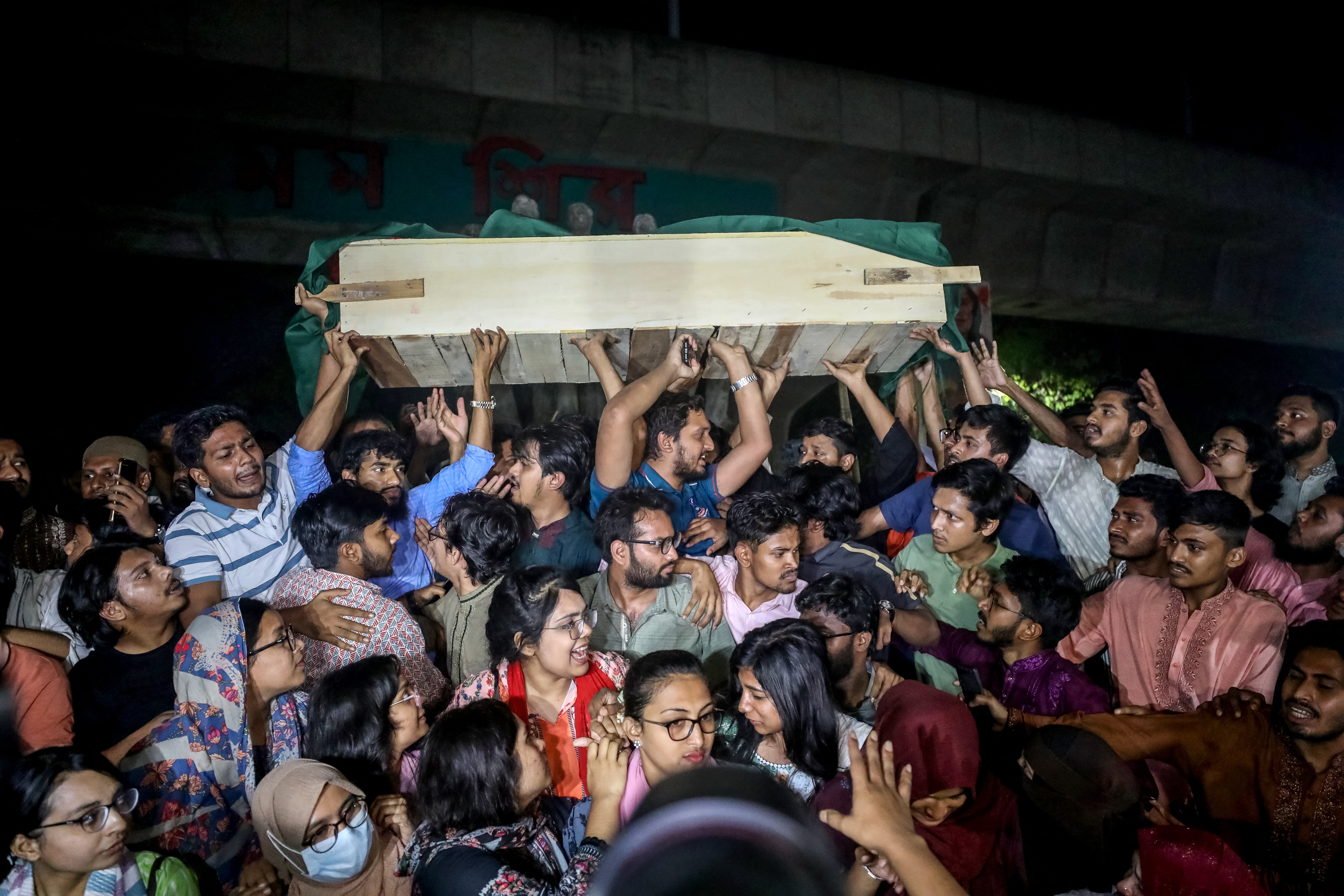 Activists protest with a mock coffin at Dhaka University