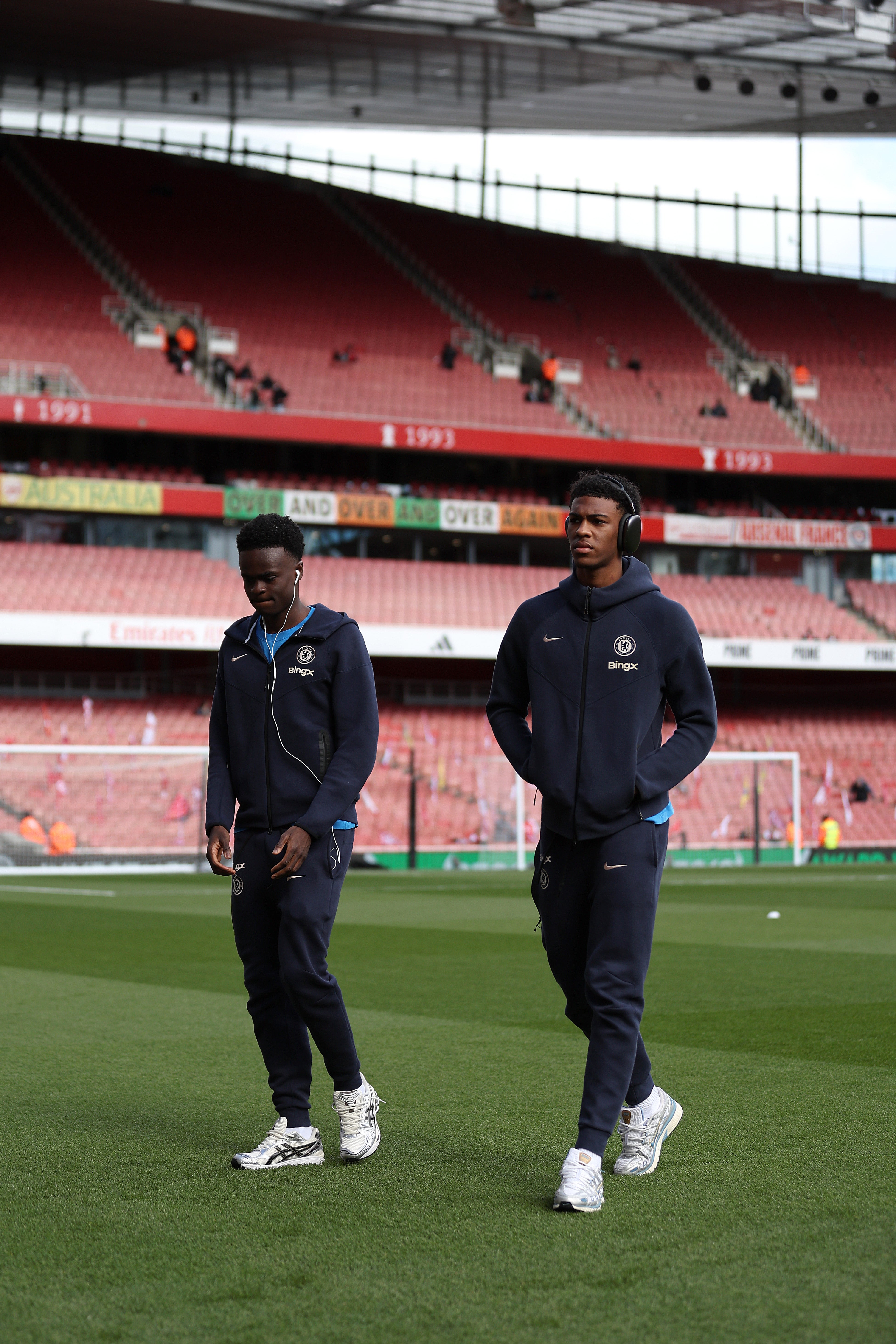 Tyrique George and Josh Acheampong of Chelsea inspect the pitch