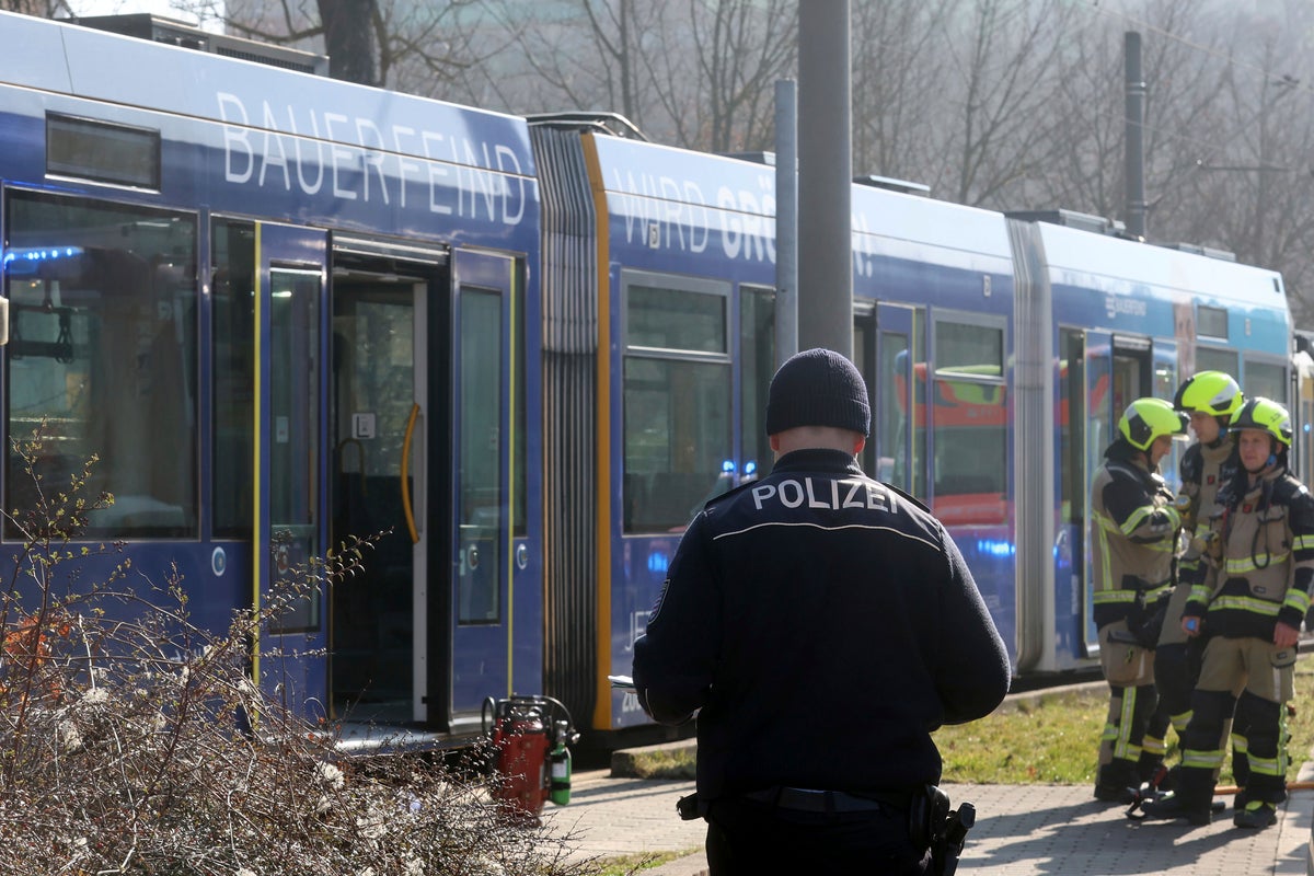 An assailant sets a woman alight on a tram in eastern Germany and flees