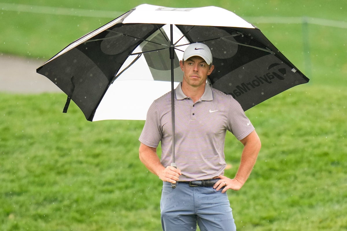 Rory McIlroy holds Players Championship lead as final round suspended