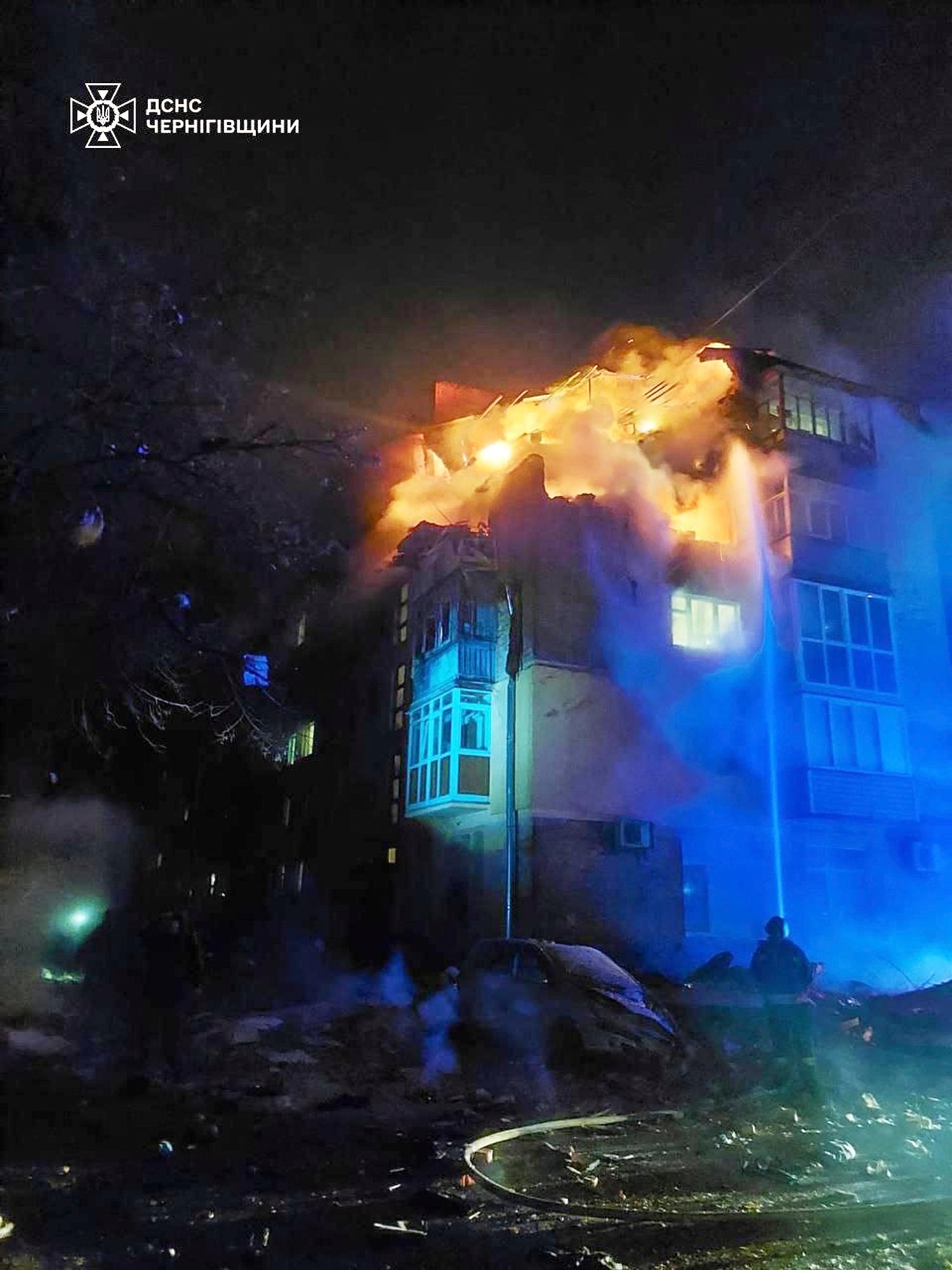 Firefighters put out a fire at a apartment building following a Russian drone attack in Chernihiv, Ukraine, on Sunday