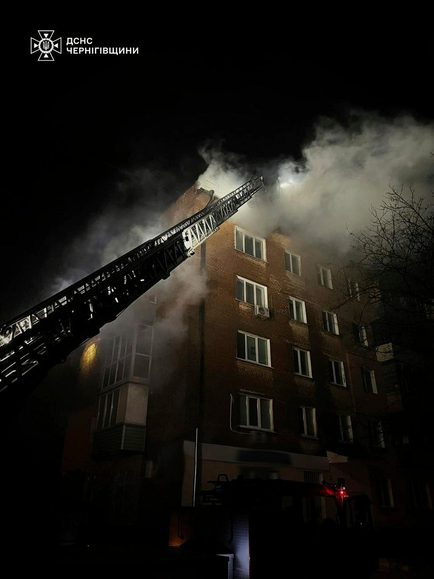 Firefighters put out a fire at a apartment building following a Russian drone attack in Chernihiv, Ukraine, on Sunday