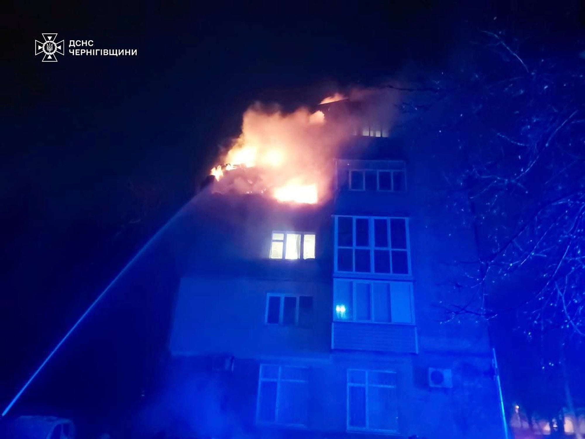 Firefighters put out a fire at a apartment building following a Russian drone attack in Chernihiv, Ukraine, on Sunday