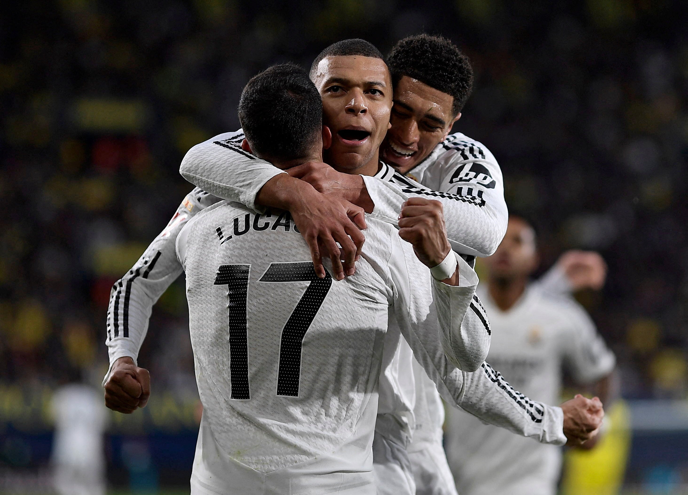 Real Madrid's Kylian Mbappe celebrates scoring their second goal against Villarreal with Lucas Vazquez and Jude Bellingham