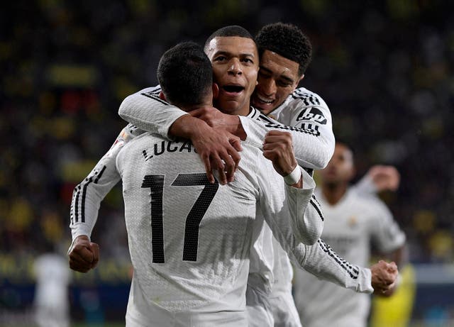<p>Real Madrid's Kylian Mbappe celebrates scoring their second goal against Villarreal with Lucas Vazquez and Jude Bellingham</p>