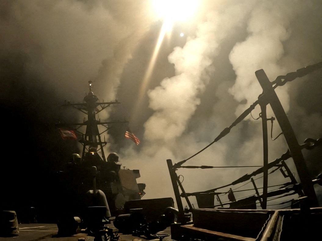 An American ship fires missiles during military strikes against Yemen