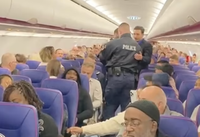<p>Police attend an alleged antisocial behaviour on a recent Wizz Air flight</p>