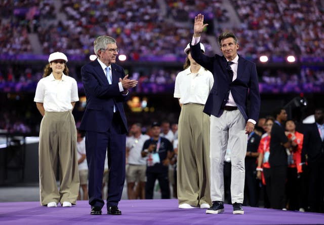 <p>Lord Coe, right, is among the favourites to succeed Thomas Bach, left as IOC president</p>