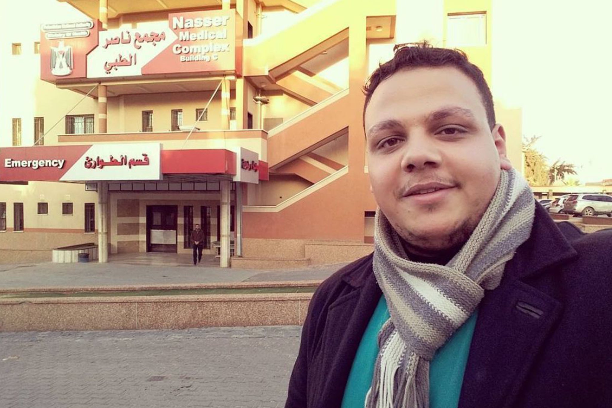 Dr Khaled al-Ser next to Nasser Hospital before it was destroyed in February 2024